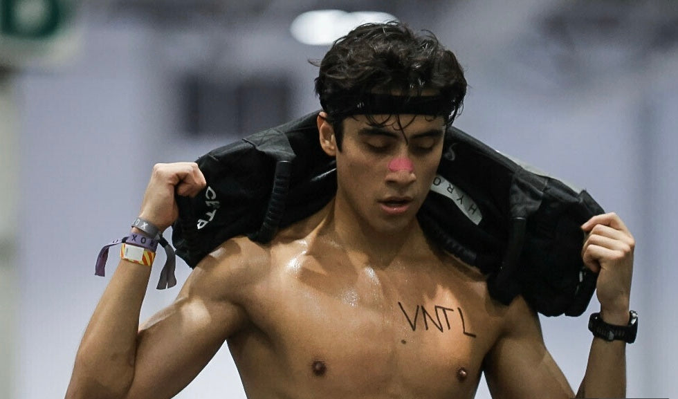 Athlete racing HYROX Toronto wearing a VNTL Electric Pink nasal strip